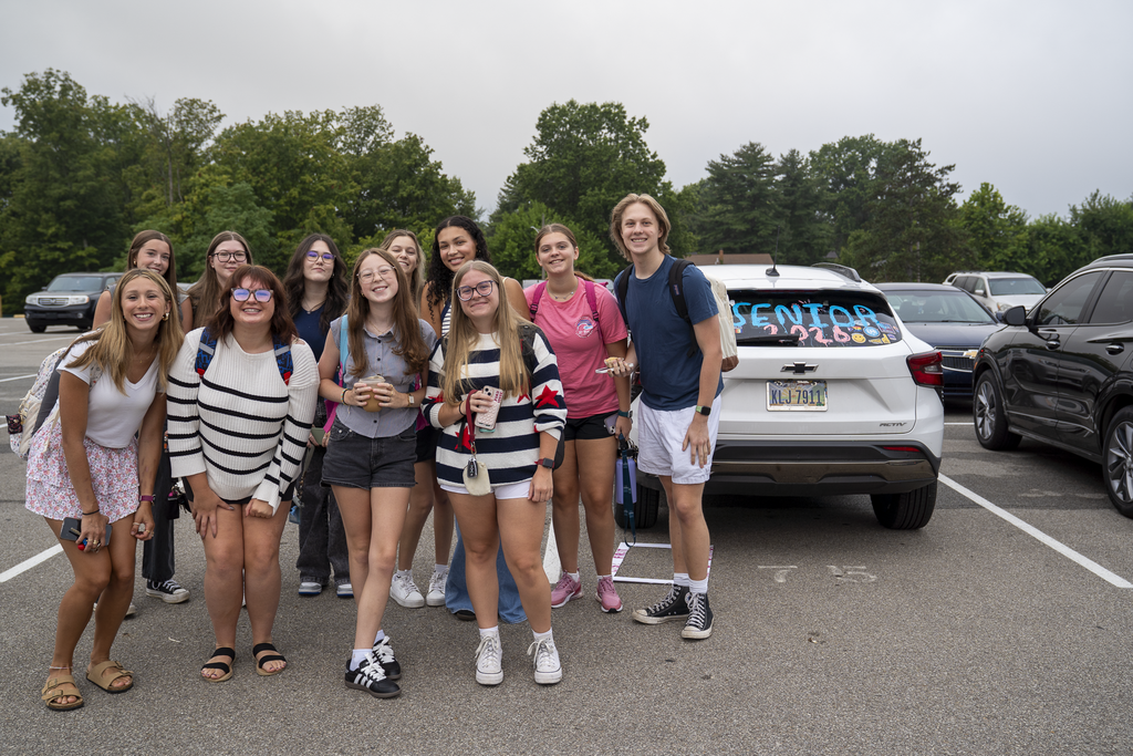 group of seniors next to a car saying "senior 2026"