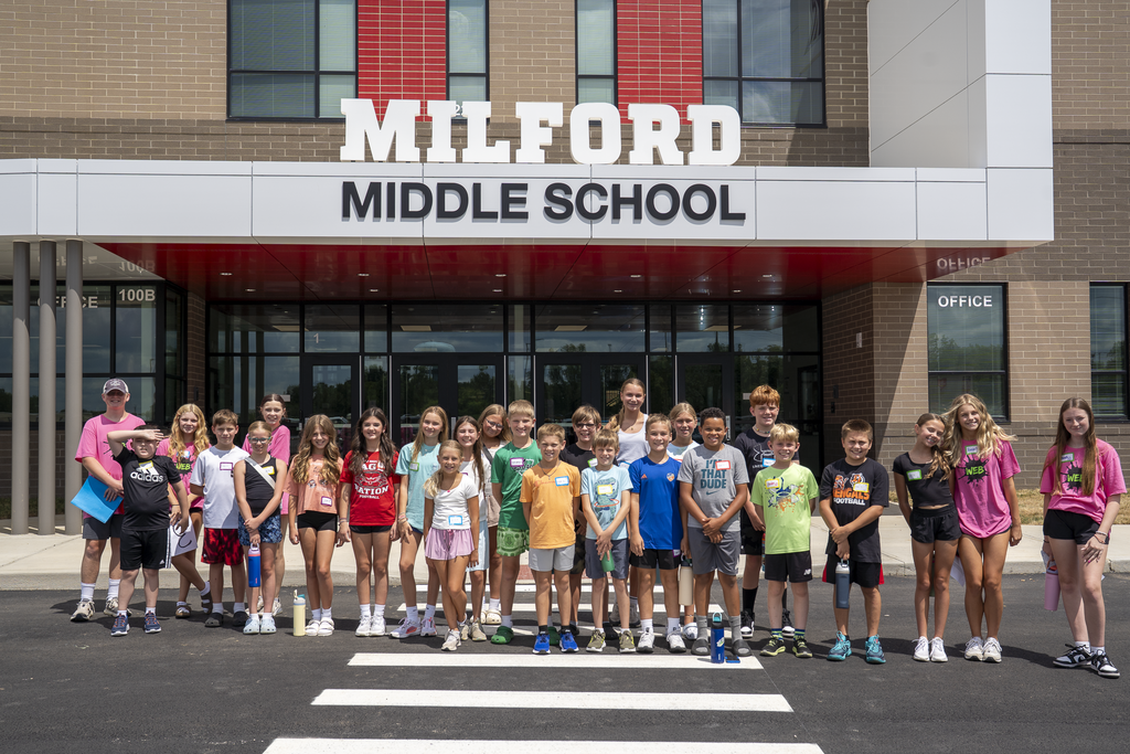 Group of students standing in front of milford middle school