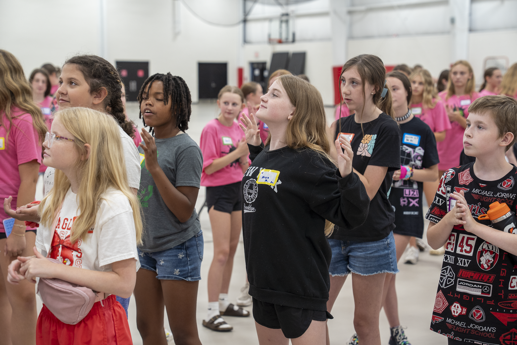 Group of students participating in a breathing exercise