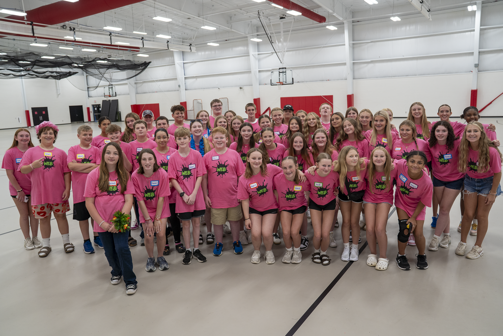 Group of students in pink shirts