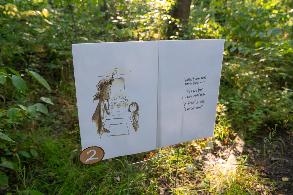 A photo from a book outside in the woods