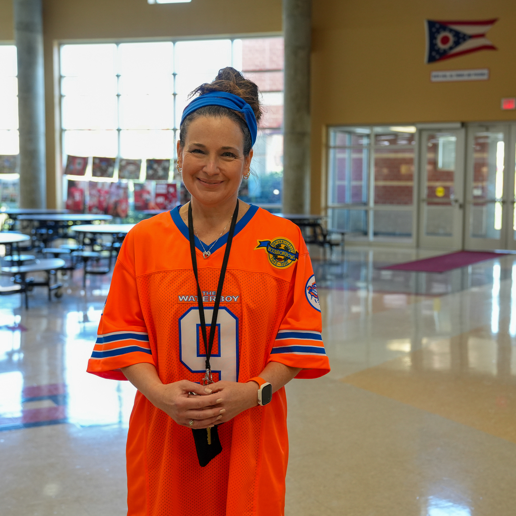 Woman smiling in orange jersey