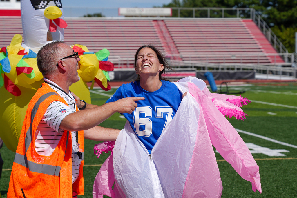 a woman in blue coming out of the axolotl costume