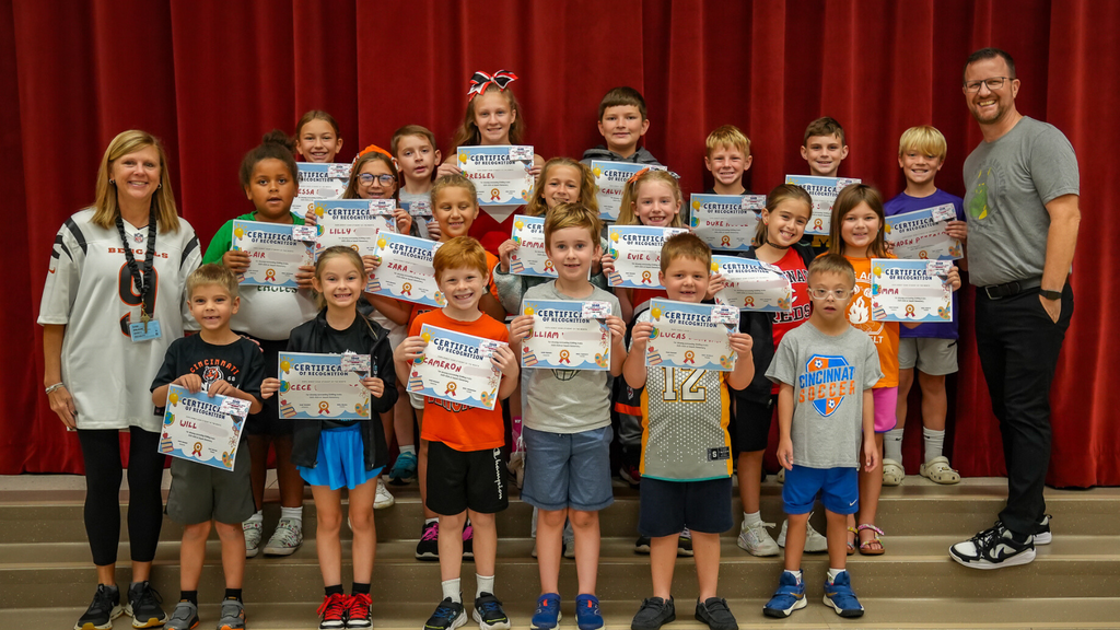 Group of students holding certificates