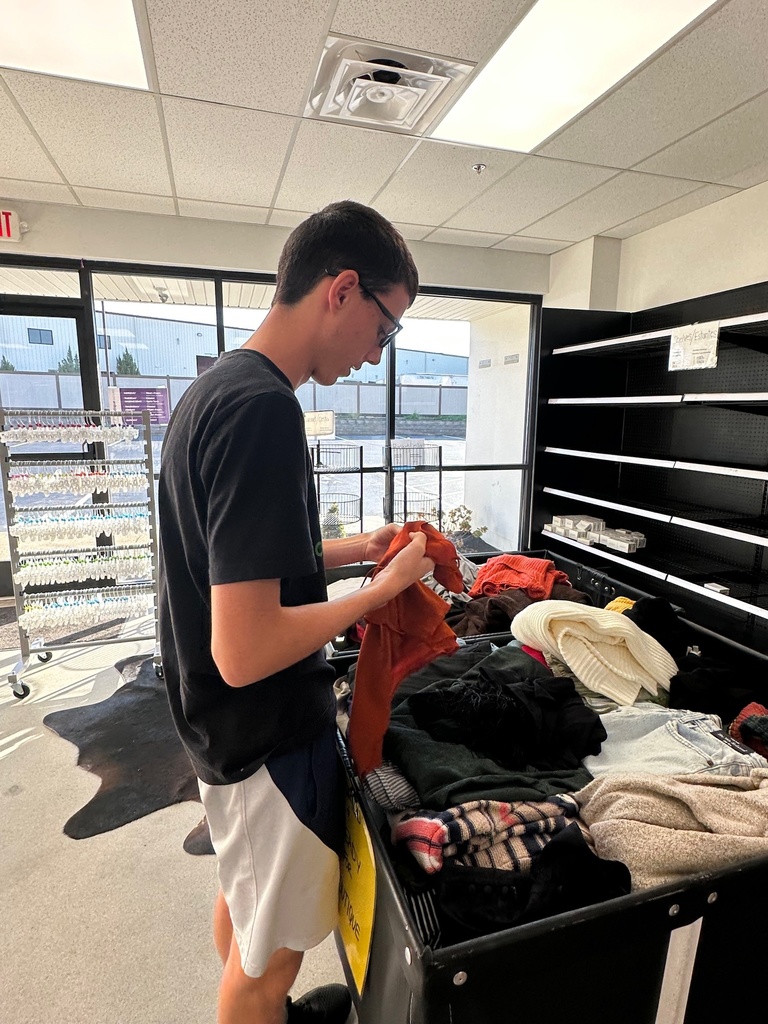 a boy storing clothes