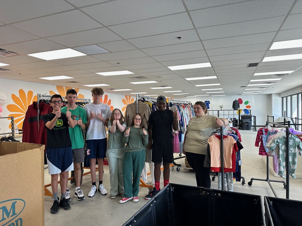 group photo of teenagers in a clothing store 