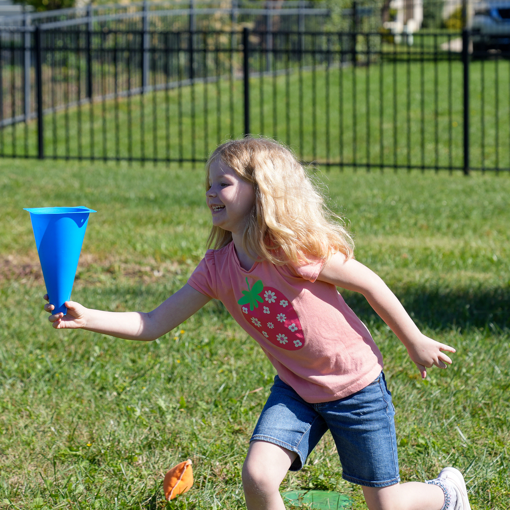 A girl holding a cone upside down