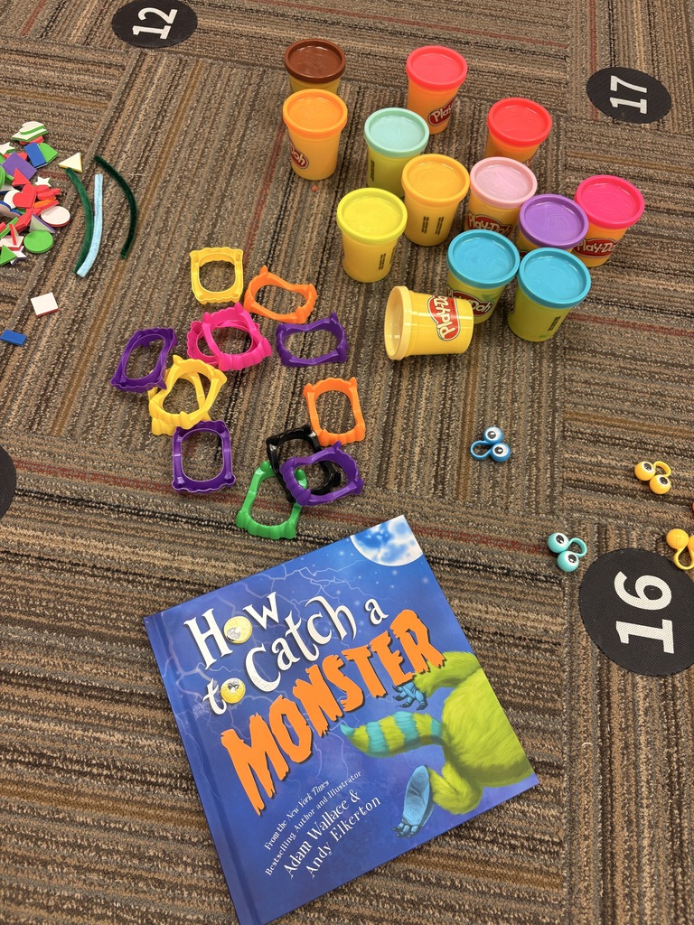 play-doh, a book and scary teeth on the floor