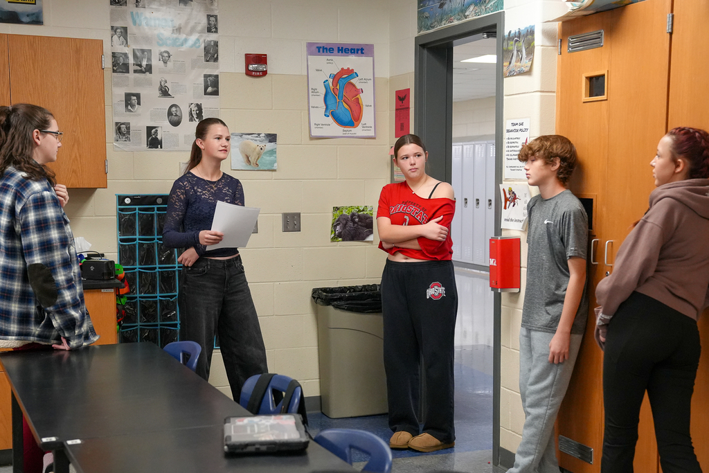 Students standing in a circle