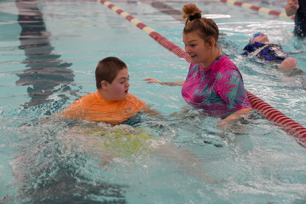 Woman smiling at boy 