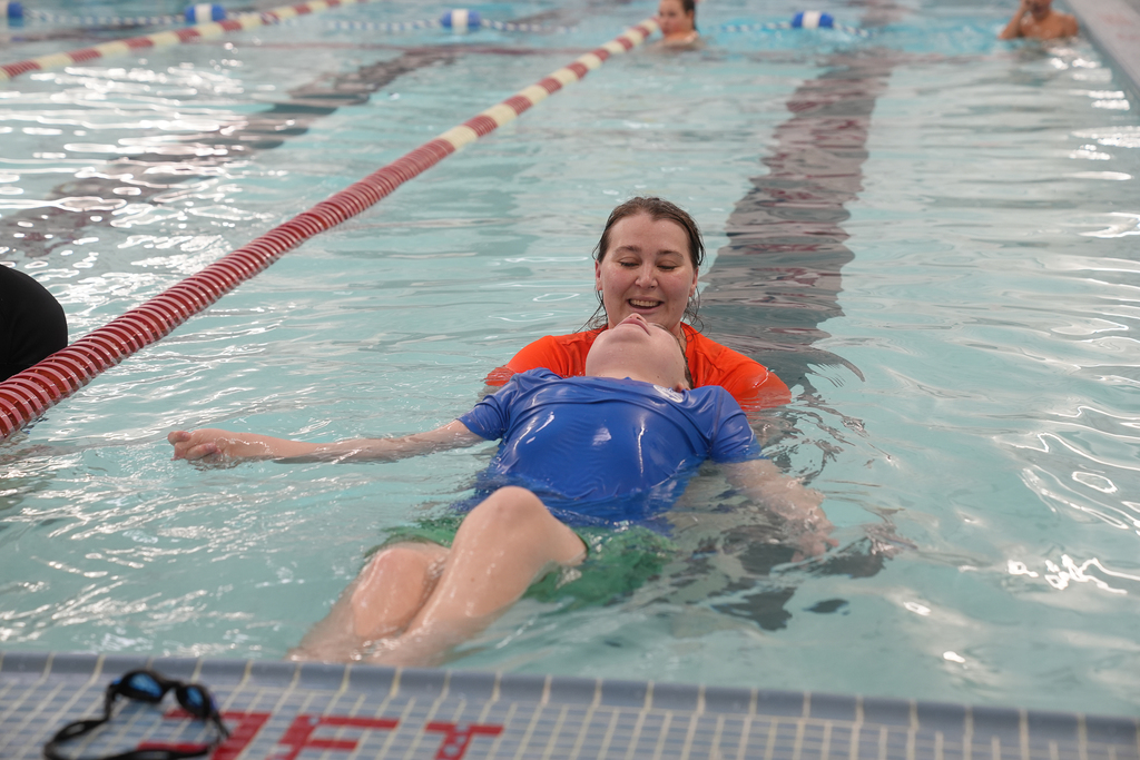Woman smiling at boy with head up