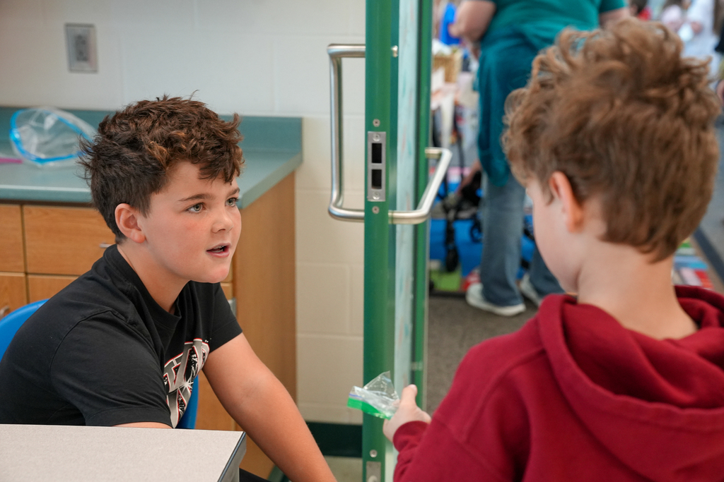 A student talking to another studen