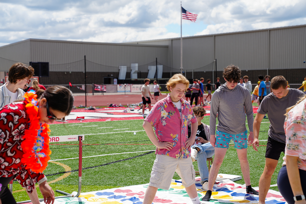 Student wearing a Hawaiian shirt playing twister