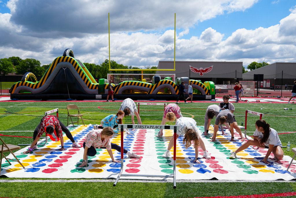 High school students playing twister