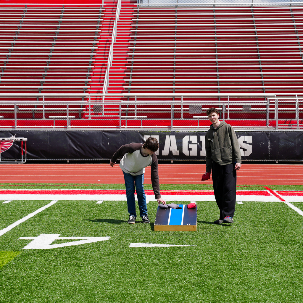 Two students playing toss