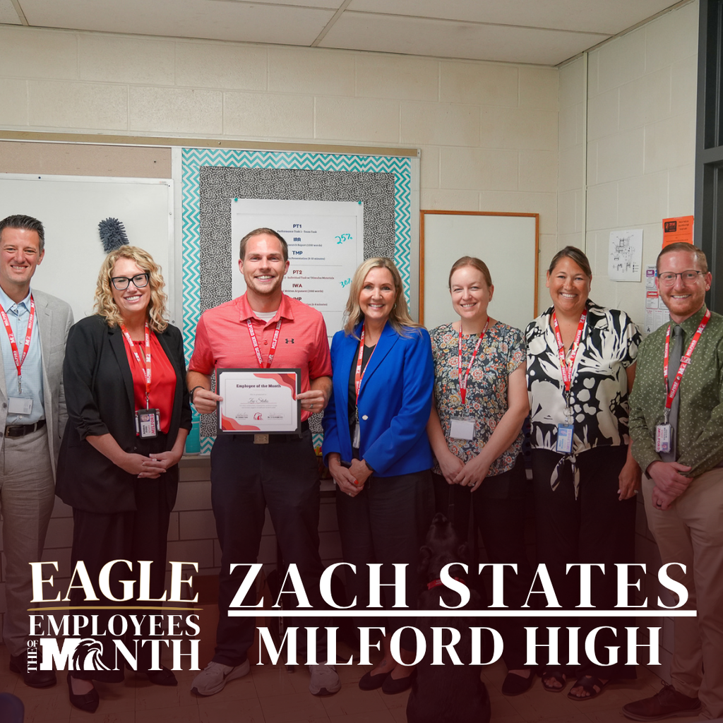 Seven school staff members stand together inside a classroom around Zach States, who is holding an "Employee of the Month" framed certificate. The text overlay reads: "EAGLE EMPLOYEES OF THE MONTH — ZACH STATES — MILFORD HIGH".