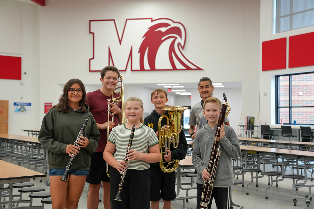 Six Milford Middle School band students selected for the Junior Cincinnati Youth Wind Ensemble pose together inside the school while holding their instruments. Pictured are Isabella Llerena, Elizabeth Benton, Kellen Whitcomb, Lucas Gerlach, Ben Lentz and Noah Miller.