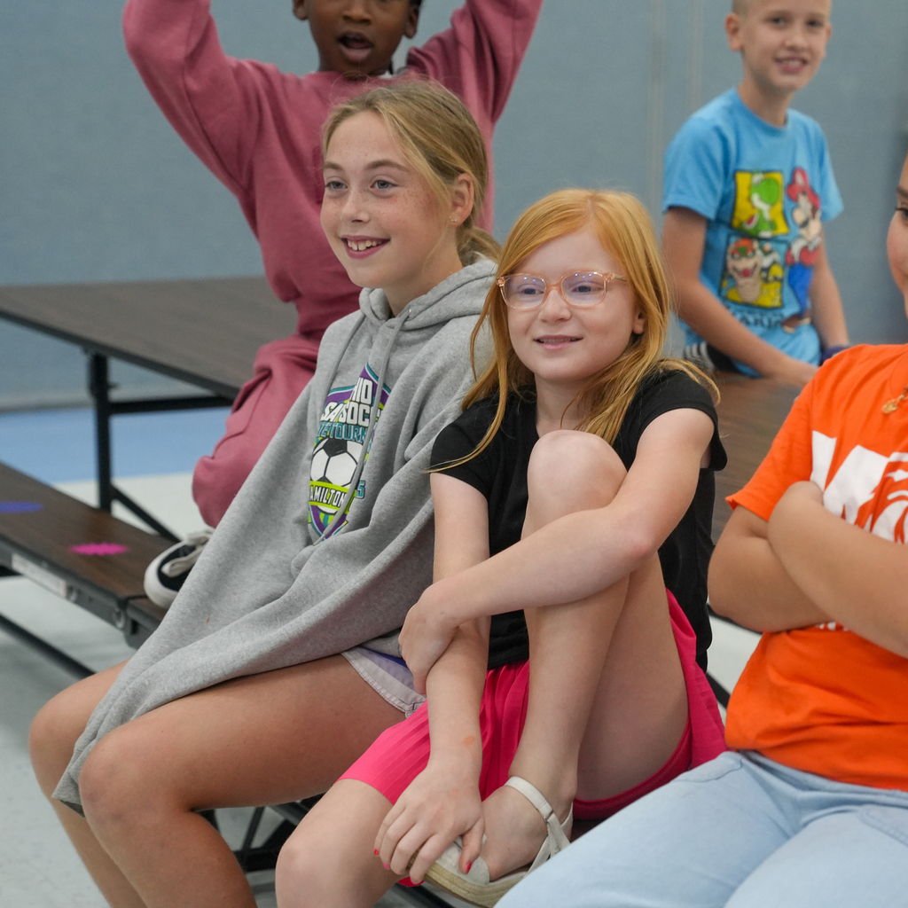 McCormick Elementary students smile while watching a lesson on following step-by-step directions to make a peanut butter and jelly sandwich.