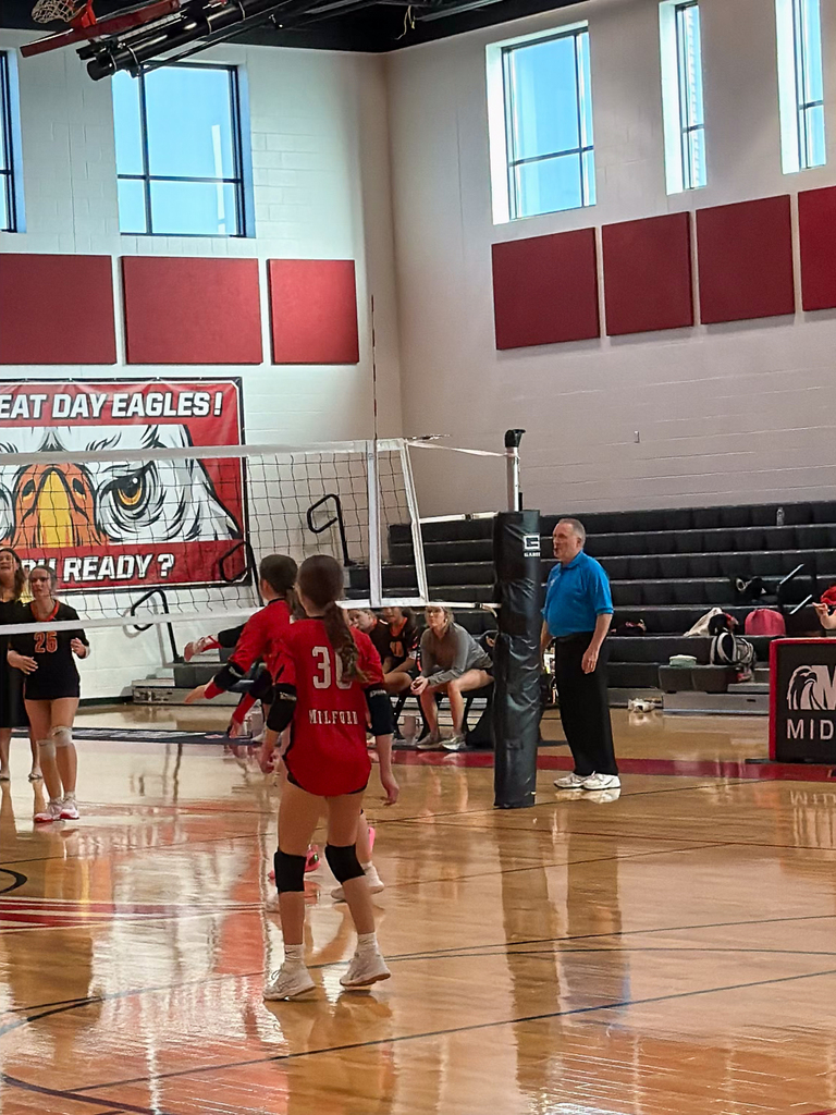 Middle School girls playing volleyball