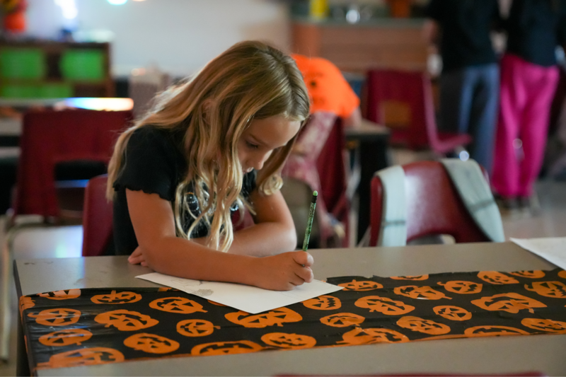 Girl writing on paper