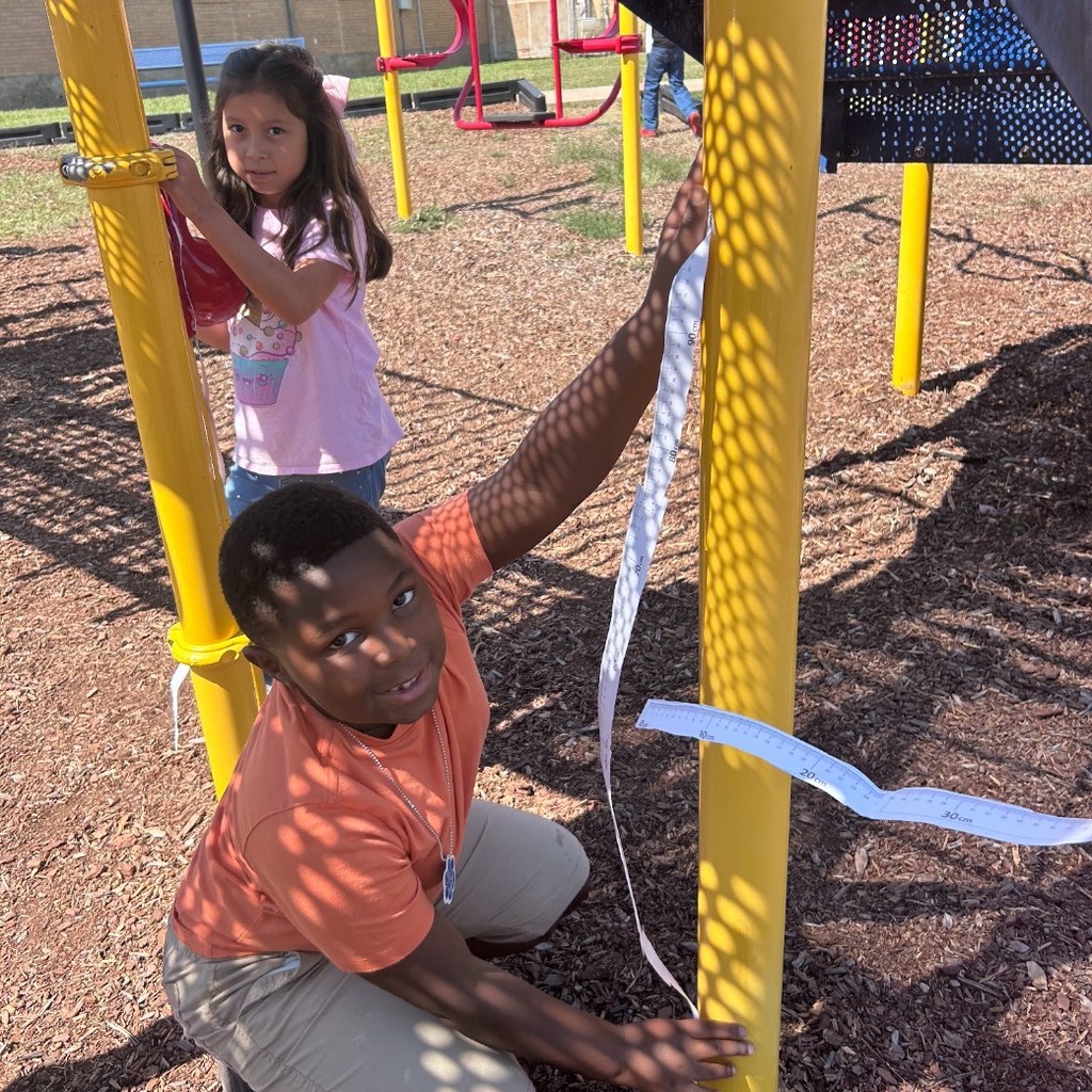 Making meter sticks and measuring the playground in 2nd grade!