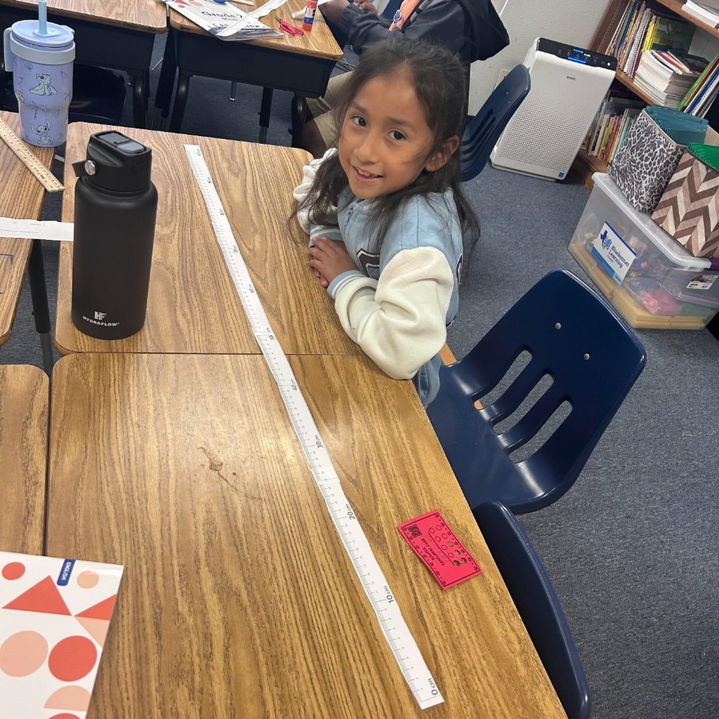 Making meter sticks and measuring the playground in 2nd grade!