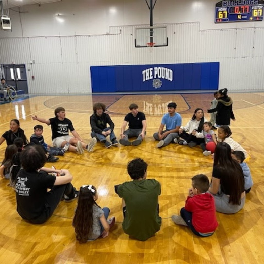 Today we had partner PE with Coach Turner’s 11th-grade psychology class. They came over to interact with our Pre-K students, and it went really well!