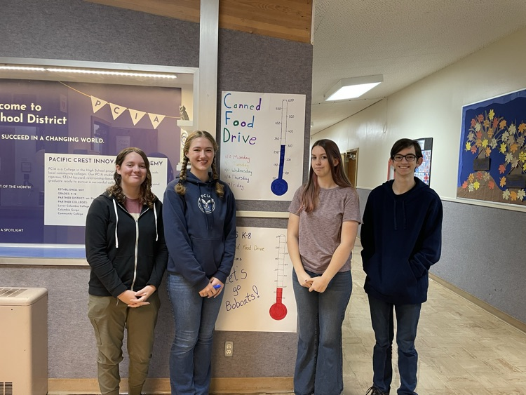 kids standing by poster