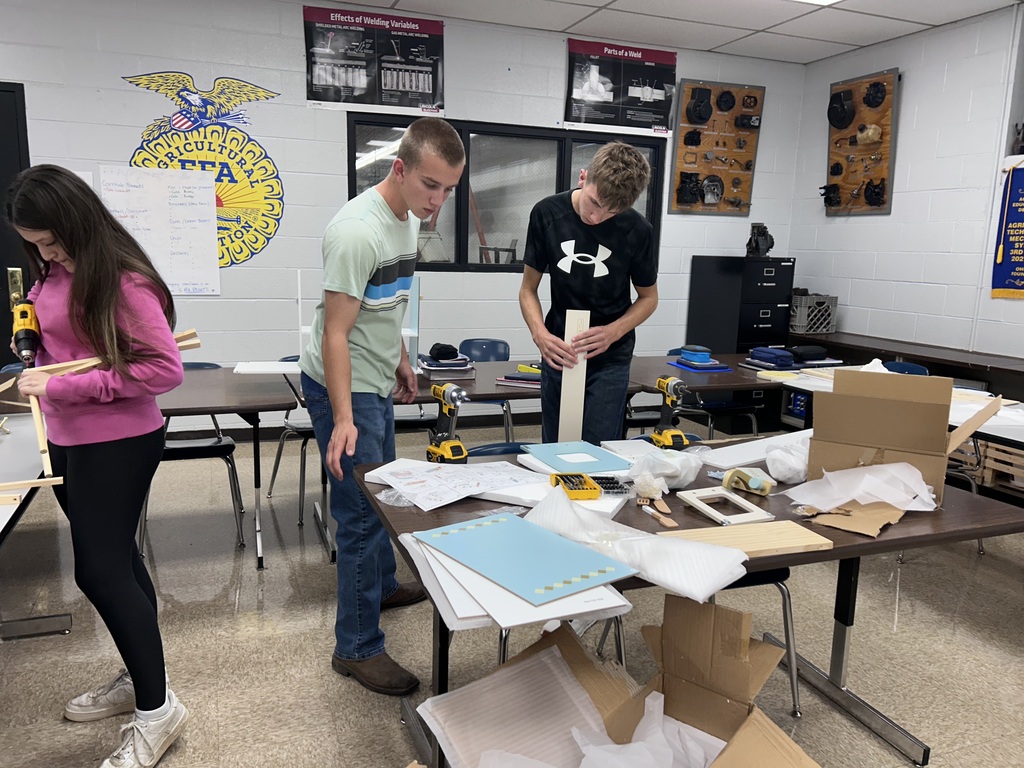 Ag students assembling playset