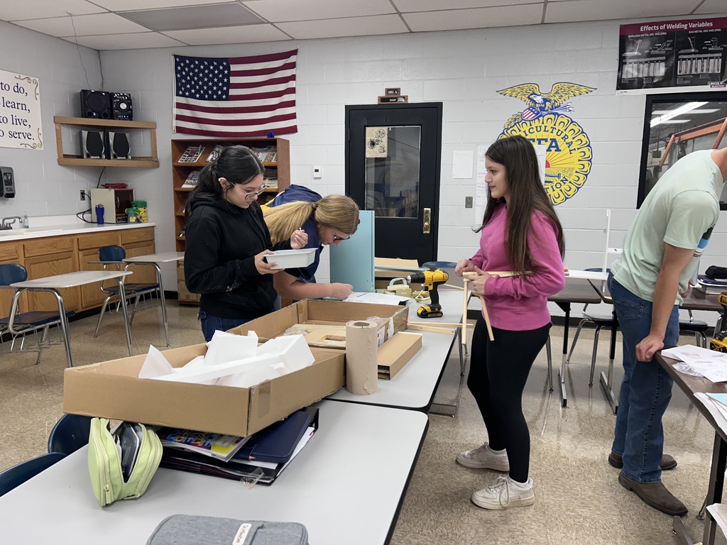 Ag students assembling playset