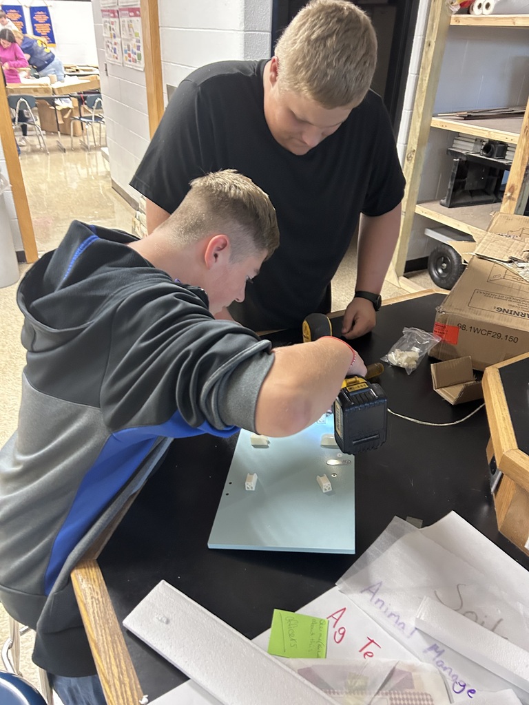 Ag students assembling playset