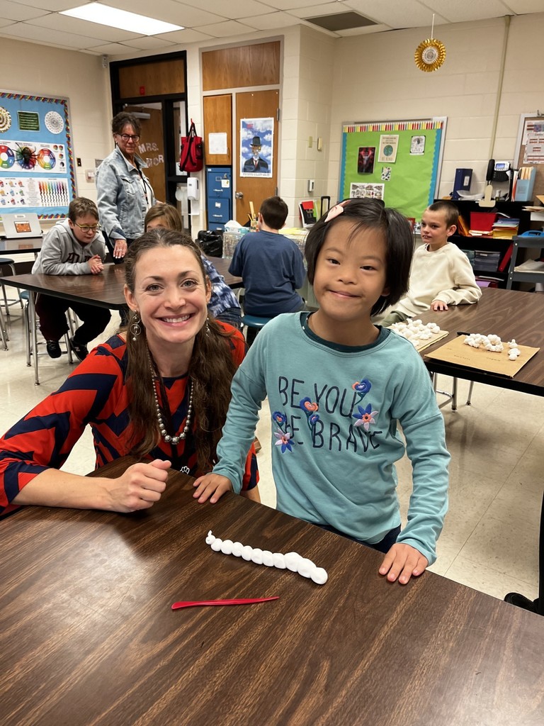 Mrs. Mori helping students learn about Art!