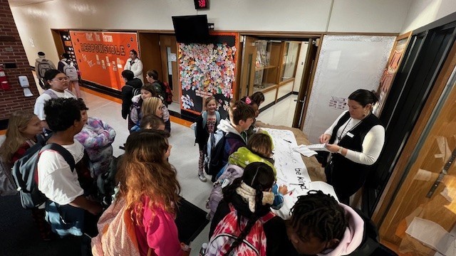 Students waiting to sign.