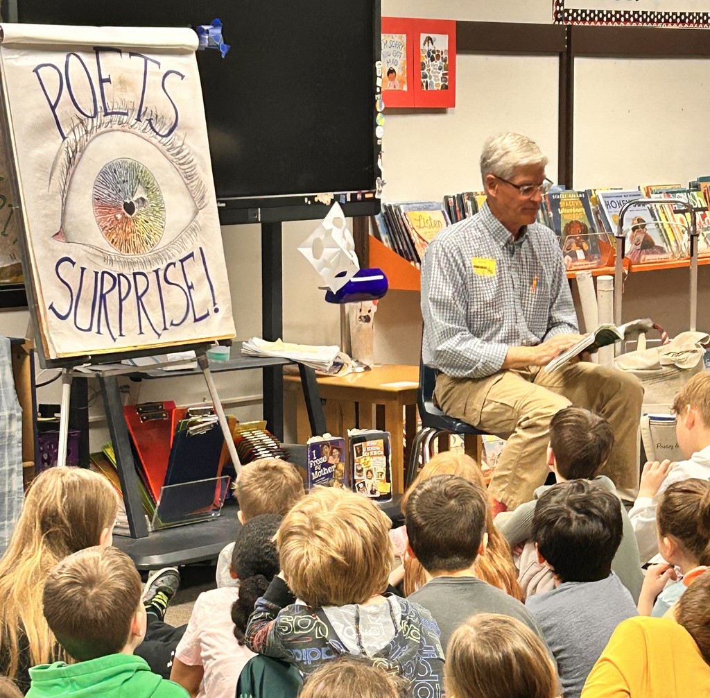 Ted reading to students