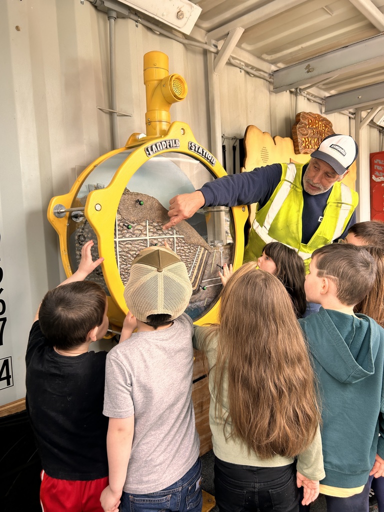Students learning about landfills