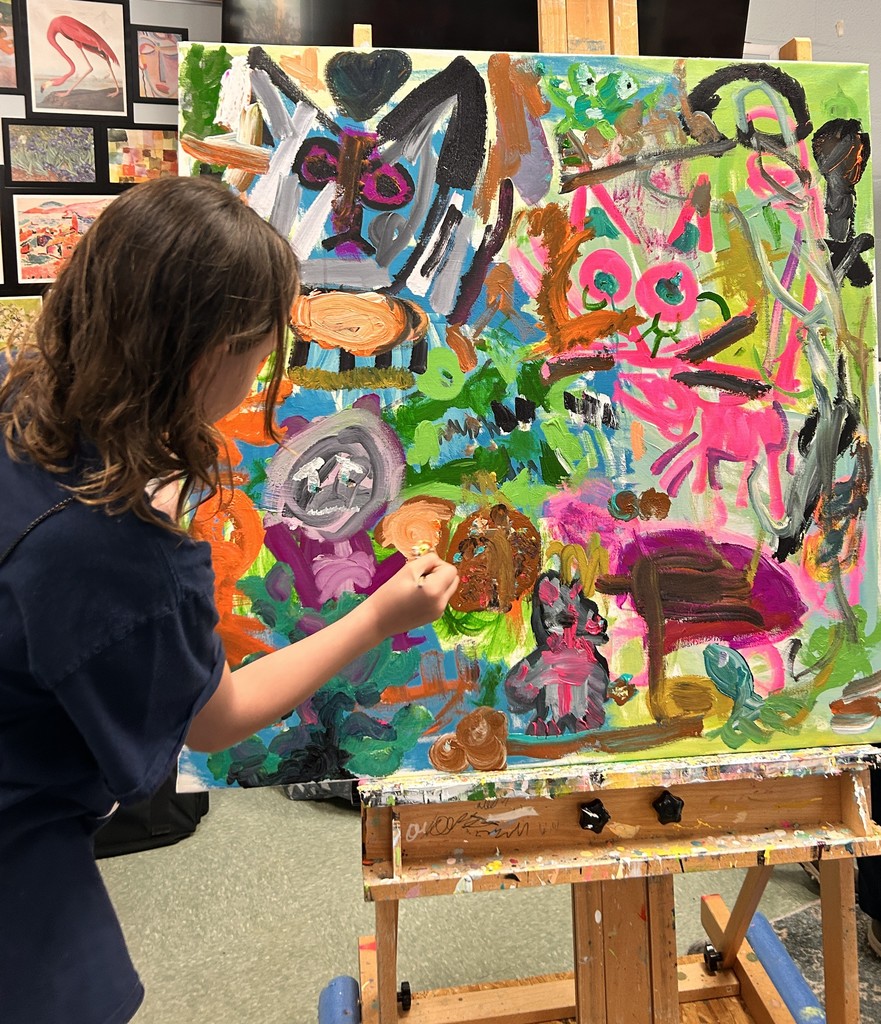 Student painting abstract art.