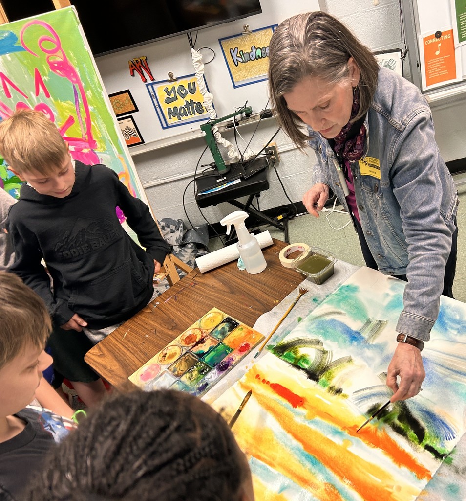 Joan demonstrating watercolor painting.