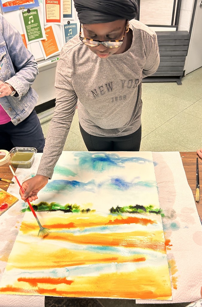 Student painting in watercolor