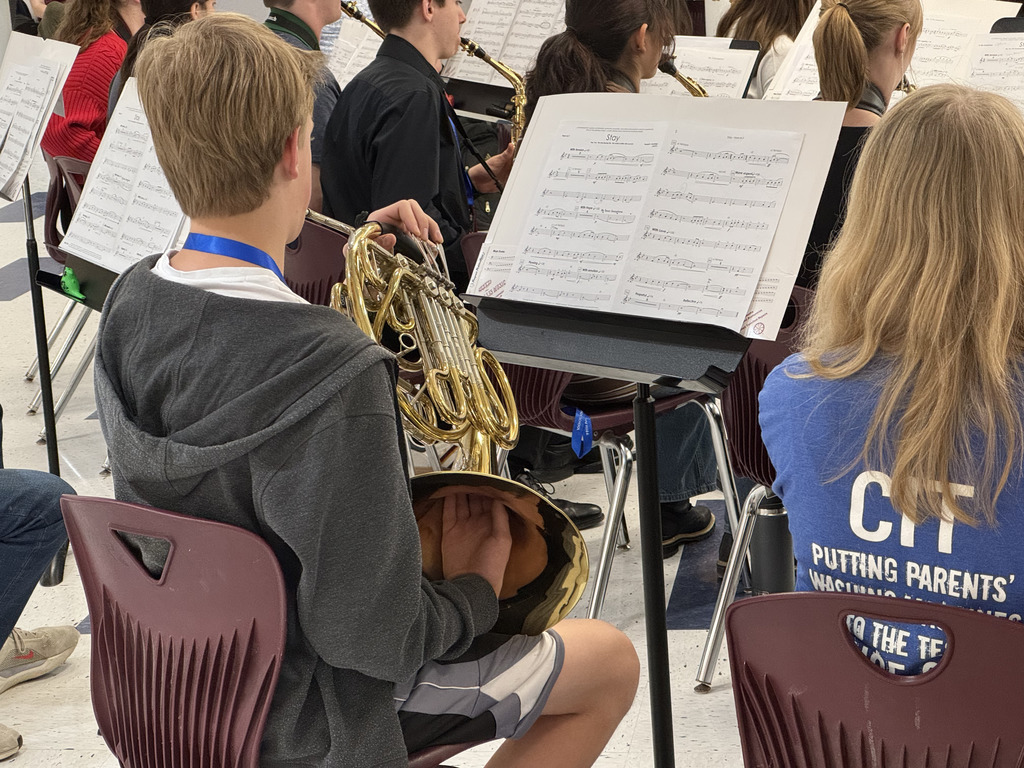 All state band student rehearsing