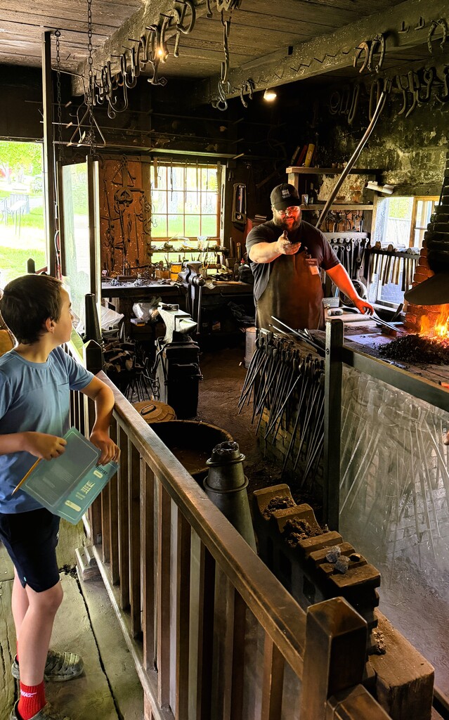 Students touring a blacksmith shop.