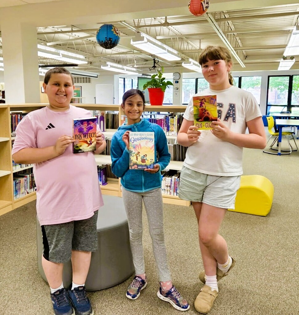 Students showing Golden Dome books