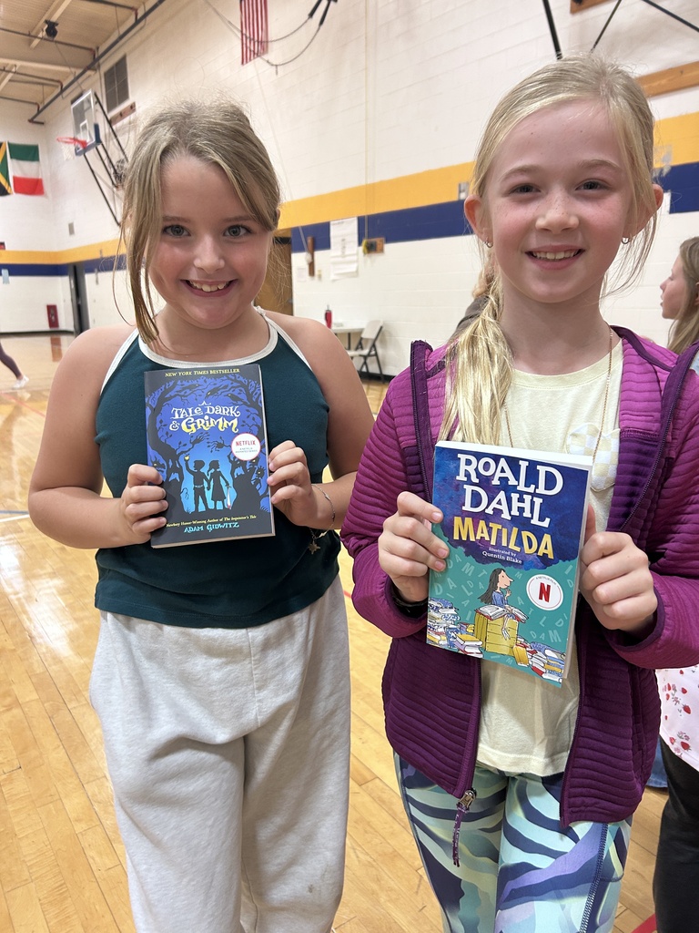 Students showing their books.