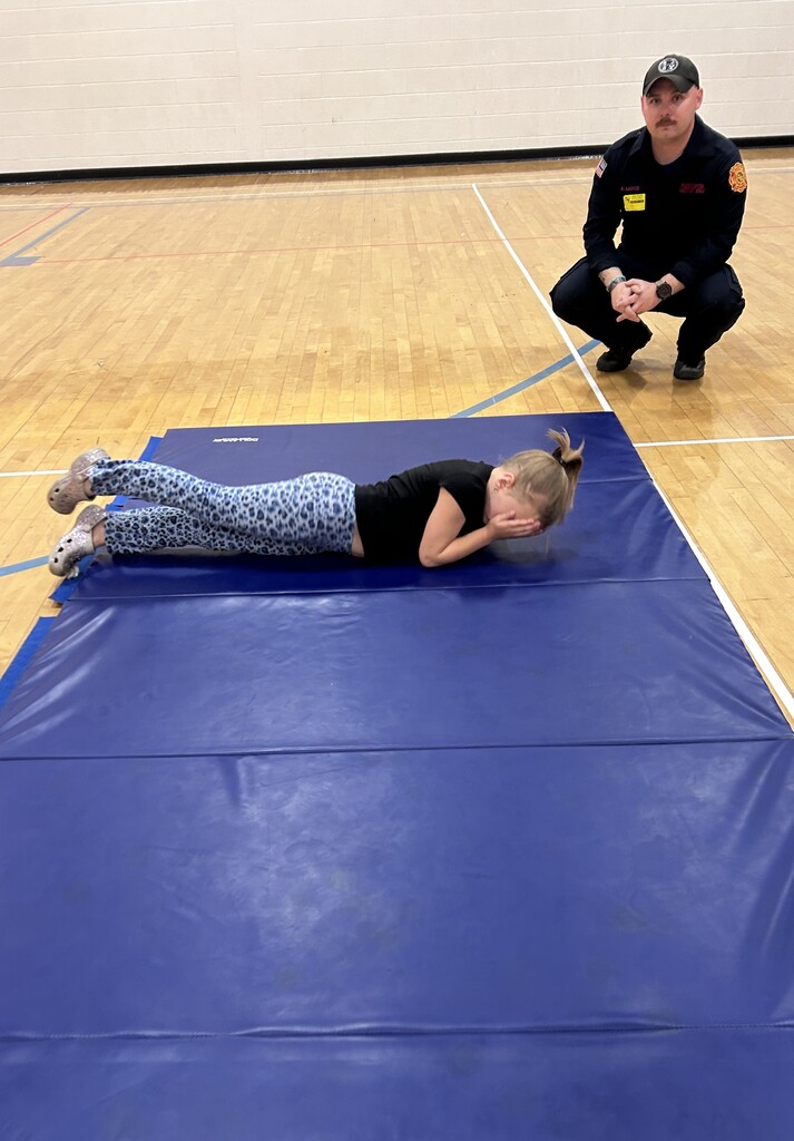 student stop, dropping, and rolling
