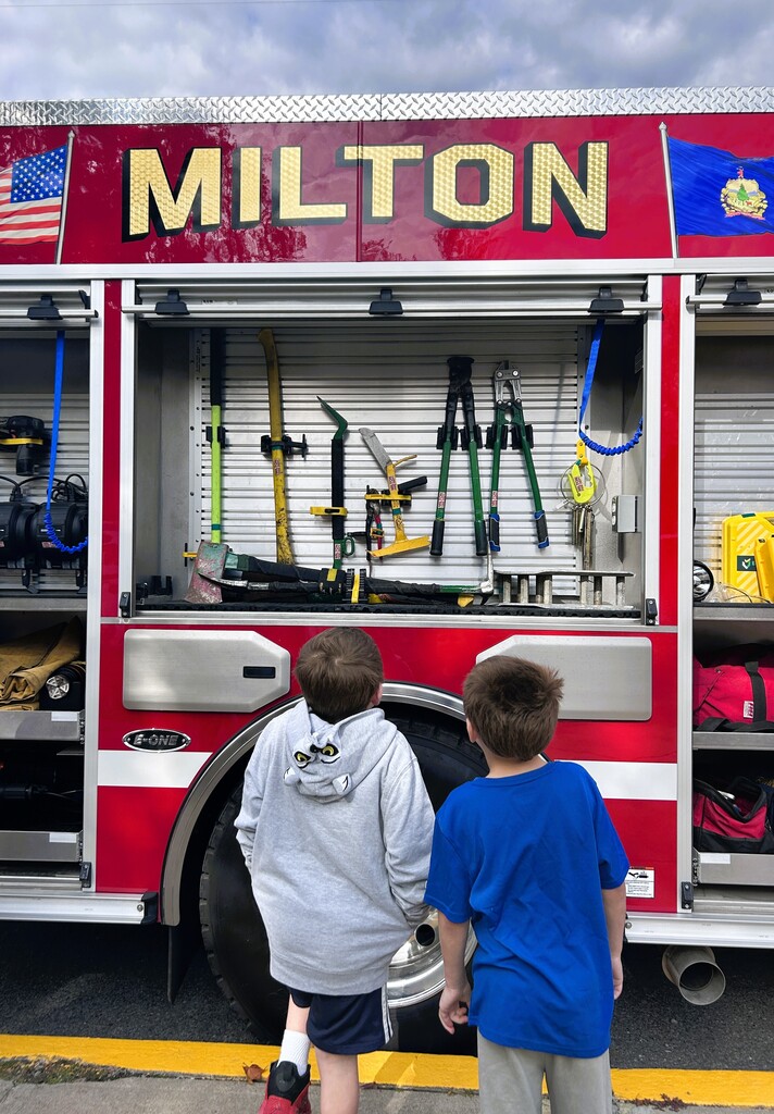 students looking at fire tools