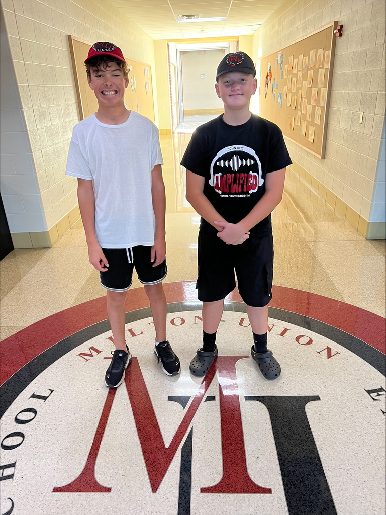 Two middle school students - Hat Embroidery Project