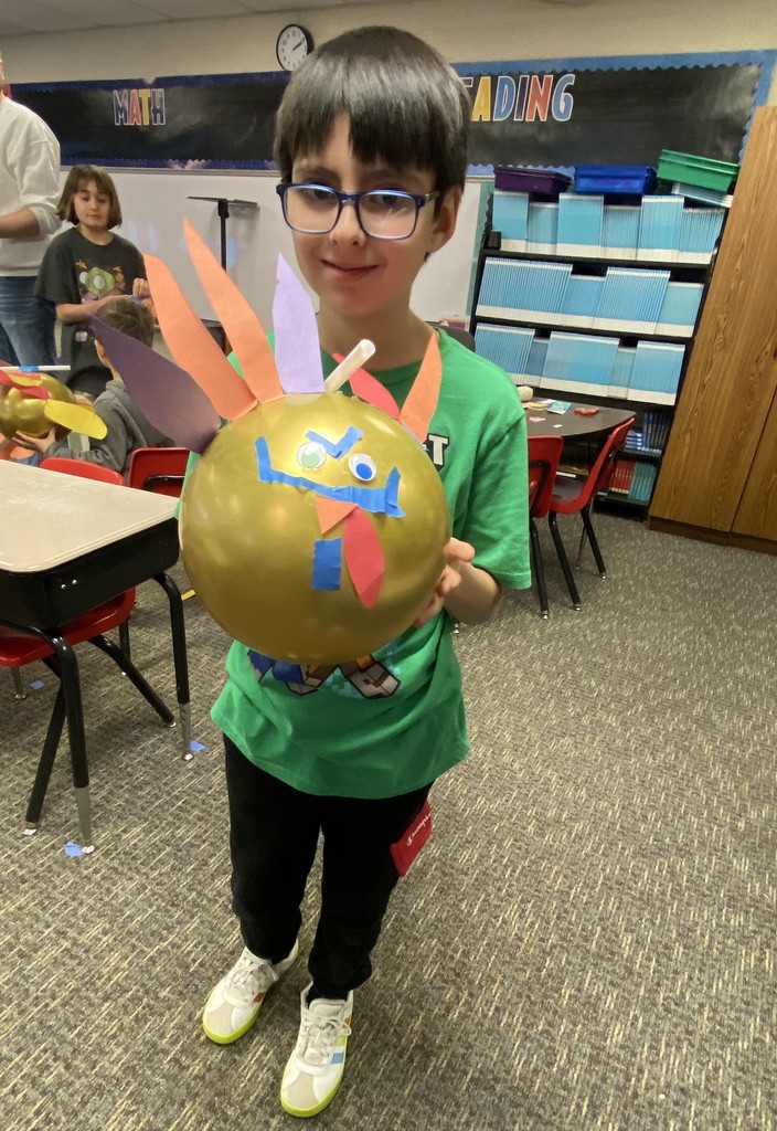 Student with his balloon turkey.