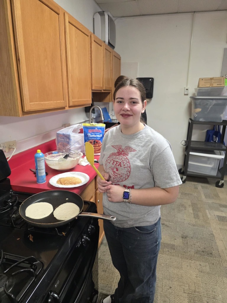 Zoe cookiing breakfast for FFA Staff breakfast