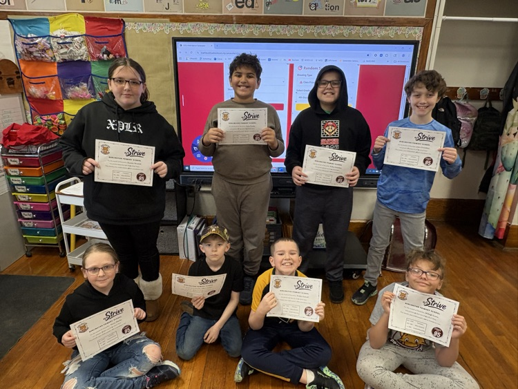 A photo of 4th graders with 95% and above for December. 