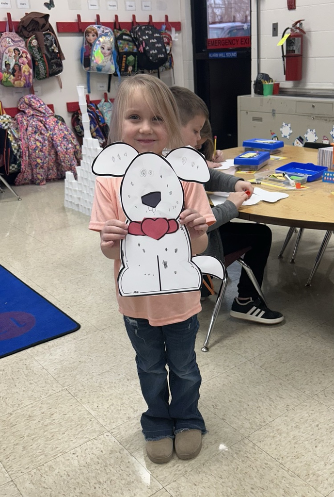Photo of student and Dalmatian craft.