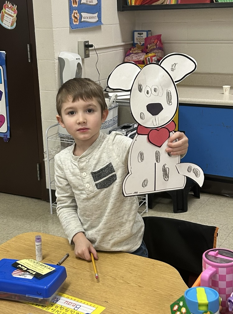 Photo of student and Dalmatian craft.